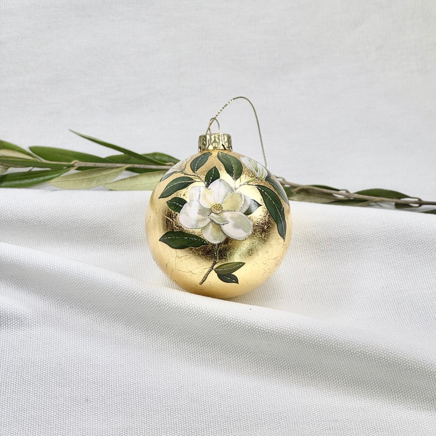 Golden Glass Ball Ornament With White Flowers