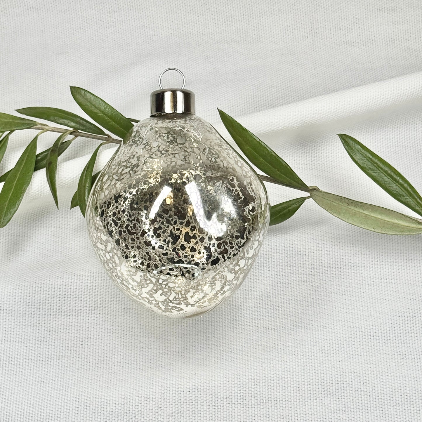 Shimmering Silver Toned Glass Ornament