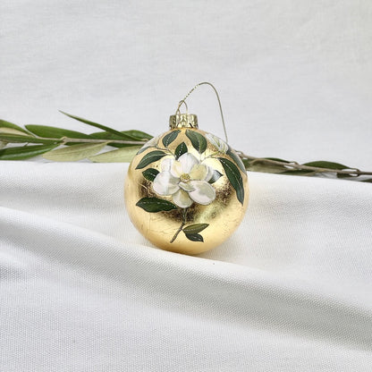 Golden Glass Ball Ornament With White Flowers
