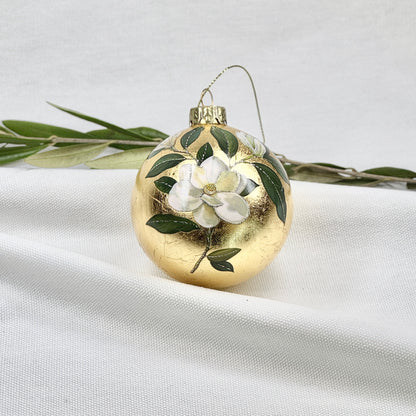 Golden Glass Ball Ornament With White Flowers