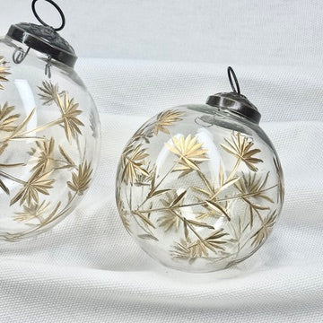 Glass Ball Ornament With Golden Floral Motif