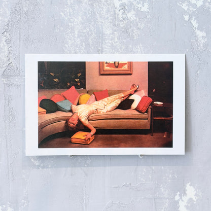Woman Lounging on Couch Retro Postcard
